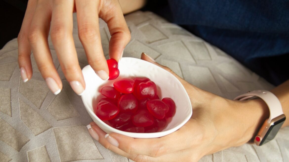 Woman eating Feminine Balance Gummies